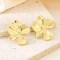 Macro view of vintage 18K gold plated stainless steel floral earrings on stone - Gold Blooming Flower (KE114004-KFC)