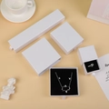 White sliding drawer jewelry boxes in four sizes with ribbon handles and black foam inserts - Ice White Pearl