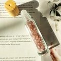 Essential oil glass roller bottle with natural pink quartz chips and wooden cap - Strawberry Quartz