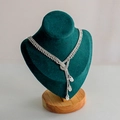 Elegant silver Y-shaped tassel necklace with rhinestones on a green velvet mannequin stand - Small Green Velvet
