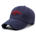 Distressed navy cotton baseball cap with red 3D SEVENTH embroidery shown at 45-degree angle - Navy Blue