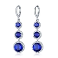 Silver drop earrings featuring vibrant blue zircon stones surrounded by clear crystals - Earrings / Blue