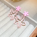 Macro detail of pink mesh flower earrings with tassel petals in a jewelry box - Pink Hollow Flower Drop Earrings (Silver Pin)