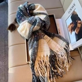 Classic black, white and yellow plaid scarf with soft fringe on a leather sofa - White Plaid