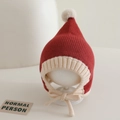 Detailed knit texture of red and white wizard hat with white pompom and chin straps - 6-24 Months / Red