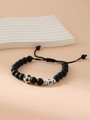 Adjustable matte black beaded bracelet featuring silver soccer charm and white letter R bead - Letter R