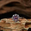 Detailed macro view of a round purple amethyst ring with sparkling diamond halo setting - Smooth Halo Design (LR351)