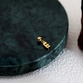 Customizable gold letter E pendant with a polished metallic finish on marble - Letter Pendant (E) / Gold