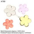 White silicone mold for 5-petal flowers with colorful clay samples and size labels - Gray
