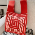 Knitted tote bag with red and beige geometric radial wave pattern and integrated handles - Dizziness Palindrome Red