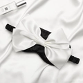 Silk sleep mask in black with a large cream-white decorative bow and elastic strap - Black