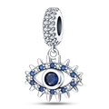 Macro shot of silver evil eye charm bead with blue and clear zircon stones for bracelet - Spiked Evil Eye Dangle