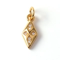 Macro detail of gold-plated rhombus charm featuring four inlaid cubic zirconia stones - Rhombus Zirconia