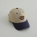 Close-up of CHILL OUT embroidery on two-tone beige and navy cotton baseball cap - 52-54cm (3-8 Years) / Khaki (CHILL)
