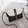 Mini crossbody bag in black and white PU leather with gold deer pendant detail - Black