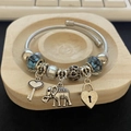 Silver woven steel bracelet with blue floral beads and elephant heart pendants - Blue Glass Bead Cupid & Elephant Bracelet
