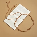 Boho woven waist chain featuring dark brown wooden beads and cream cylindrical accents - X502-1 Light Coffee Rope