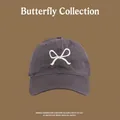 Detail of dark gray baseball cap with white bow embroidery and UV protection fabric - Front Bowknot Embroidery Baseball Cap / Gray
