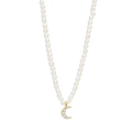 Macro detail of gold crescent moon pendant with crystals on white pearl necklace - 925 Sterling Silver / Gold-Moon