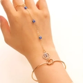 Detailed close-up of golden evil eye hand chain with blue beads and rhinestone accents - Gold Evil Eye Style (N-912)