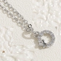 Detailed view of silver necklace with butterfly pendant and circular zircon inlay stones - Butterfly Zirconia (Platinum Plated) / Silver