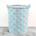 Large capacity laundry hamper featuring pink flamingo patterns on a light blue fabric base - Green Flamingo