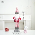 Close-up of a 55cm red plush Christmas gnome doll decoration with size markings - Snowflake Retractable Santa