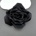 Top view of a 11cm handmade black fabric camellia rose flower with layered silk texture - Black