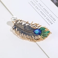 Golden peacock feather brooch with blue enamel, drop crystal and a white pearl - Blue Feather