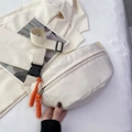 Minimalist beige canvas crossbody bag with orange zipper cords and black buckle strap - Off White