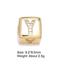 Detailed close-up of 8mm gold-plated cube bead with zircon-set letter Y for jewelry - Letter Y