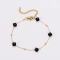 Goldenes Gliederkette-Armband mit fünf facettierten schwarzen Kleeblatt-Anhängern und Verschluss - Schwarzes Armband