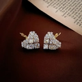 Detailed view of heart-shaped earrings with sparkling cubic zirconia on a gold base - Gold Heart Hoop Style (Ear Clip)