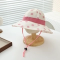 Dettaglio di cappello da sole a pois per bambina con nastro rosa e cordino regolabile - 52cm (2-5 Anni) / Rosa