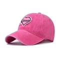 Detail of pink washed cotton baseball cap with embroidered heart patch and Colorado text - Rose Red with Pink Heart