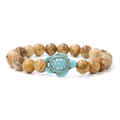 Natural brown marbled bead bracelet with turquoise turtle charm on white background - Jasper