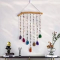 Detail of colorful agate slices hanging from a natural wood branch wind chime - Ashanla Wood Stick