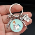 Detailed dental keychain featuring tooth, brush, toothpaste and floss charms - Cartoon Dentist Exam Style (7)