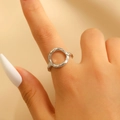 Macro detail of silver geometric ring with hand-hammered texture on woman's finger - Silver Irregular Hammered Circular Ring (0403) / Silver