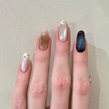 Press-on nails with blue cat eye, gold stars, and marble gradient designs on model hand - Bs2181 Is Refreshing And Invigorating. / Phototherapy Glue Style