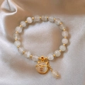 Elegant cat-eye beaded bracelet with white stones, gold accents and cat charm - Cat's Eye Stone Beaded Bracelet