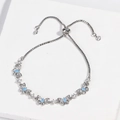 Detail of silver butterfly bracelet featuring blue gemstone and adjustable box chain - Style 7 Silver