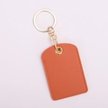 Orange leather access card holder with gold keychain ring on a white background - Square / Orange