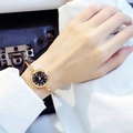 Elegant gold open cuff watch with a black round dial and twisted bracelet for women - Roman Numerals Gold Band Black Dial