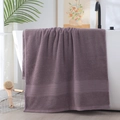 Thick purple cotton bath towel with stripe detail hanging on a white luxury bathtub - Herringbone Border Hand Towel (Rust Red/Lavender) / 34*74cm