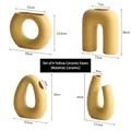 Set of four minimalist matte ceramic vases in beige and earthy tones for office decor - Earthy Yellow Ceramic Vase Set (four Pieces)