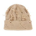 Detailed macro view of beige knitted hat featuring heavy distressed holes and long tassels - Khaki