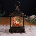 Close-up of a vintage bronze Christmas lantern with Santa Claus and swirling snow - Brushed Gold Santa & Tree (With Music)