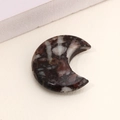 Polished crescent moon pendant made of brown and white natural agate stone - Natural Stone