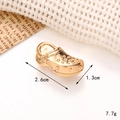 Macro detail of gold metal clog charm showing size 2.6cm and weight 7.7g specifications - C252 Gold Slippers